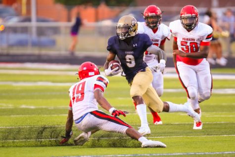 AHS Football standout Kenny Walker is gaining yards and scholarships