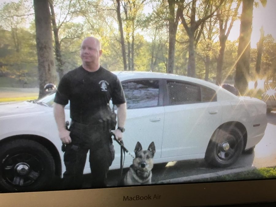 K9+Unit+standing+with+his+Partner