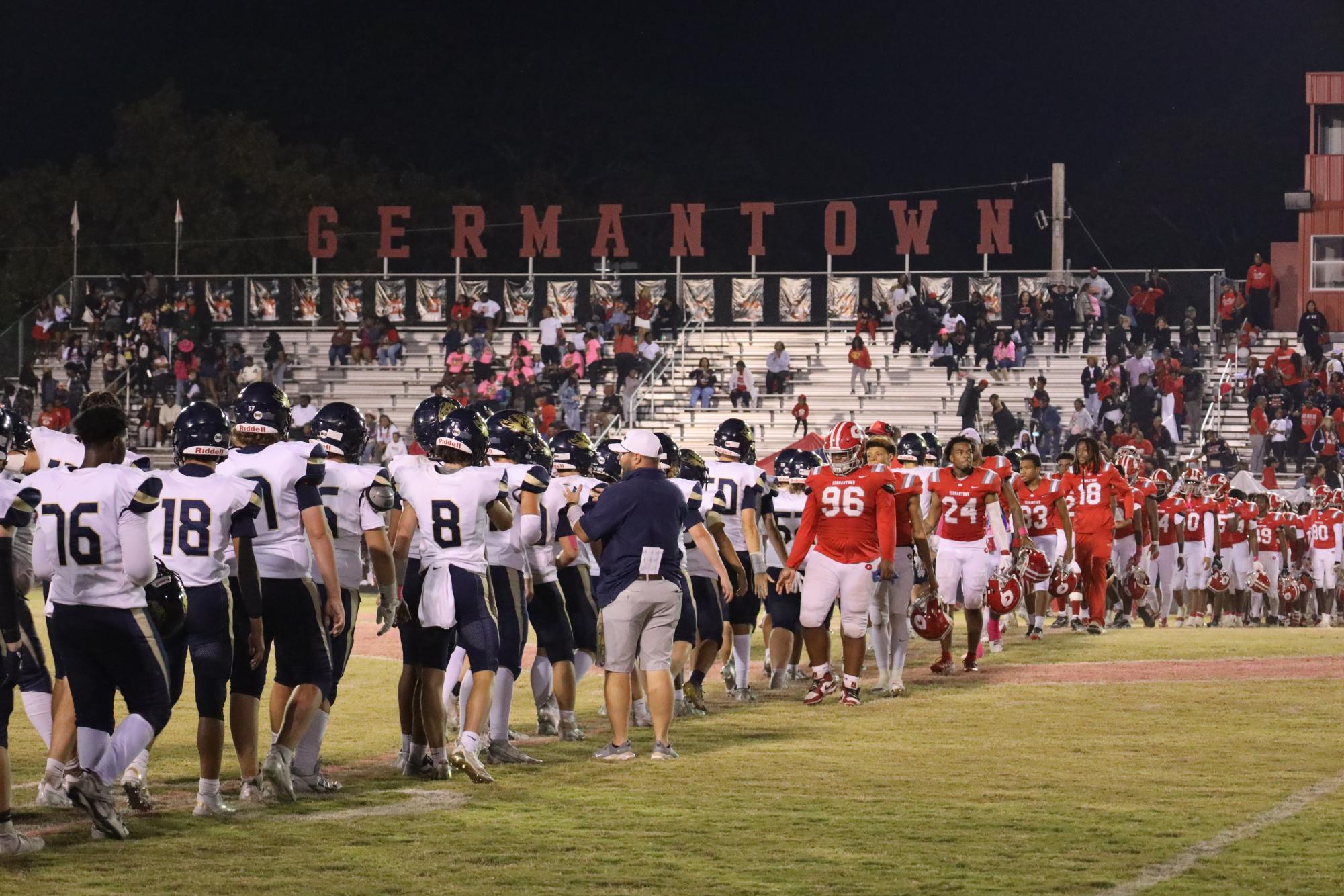 Arlington and Germantown give a friendly high five.