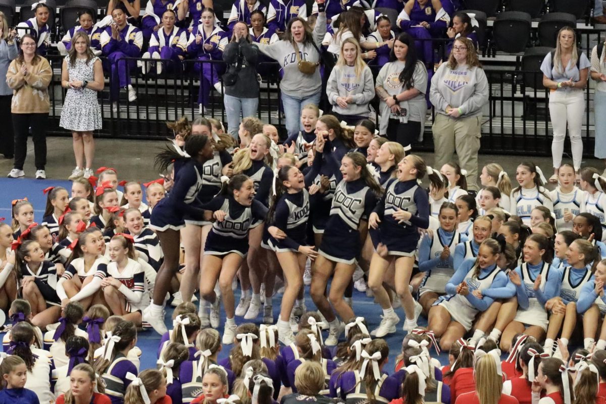 The winning middle school team jumps for joy at the 2024 UCA Magic City Regional competition.