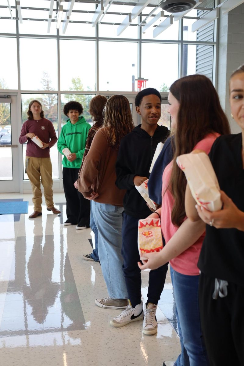 The Media strand students of PAVE line up tallest to shortest and talk to their neighbor to get to know each other at the first meeting of the year.