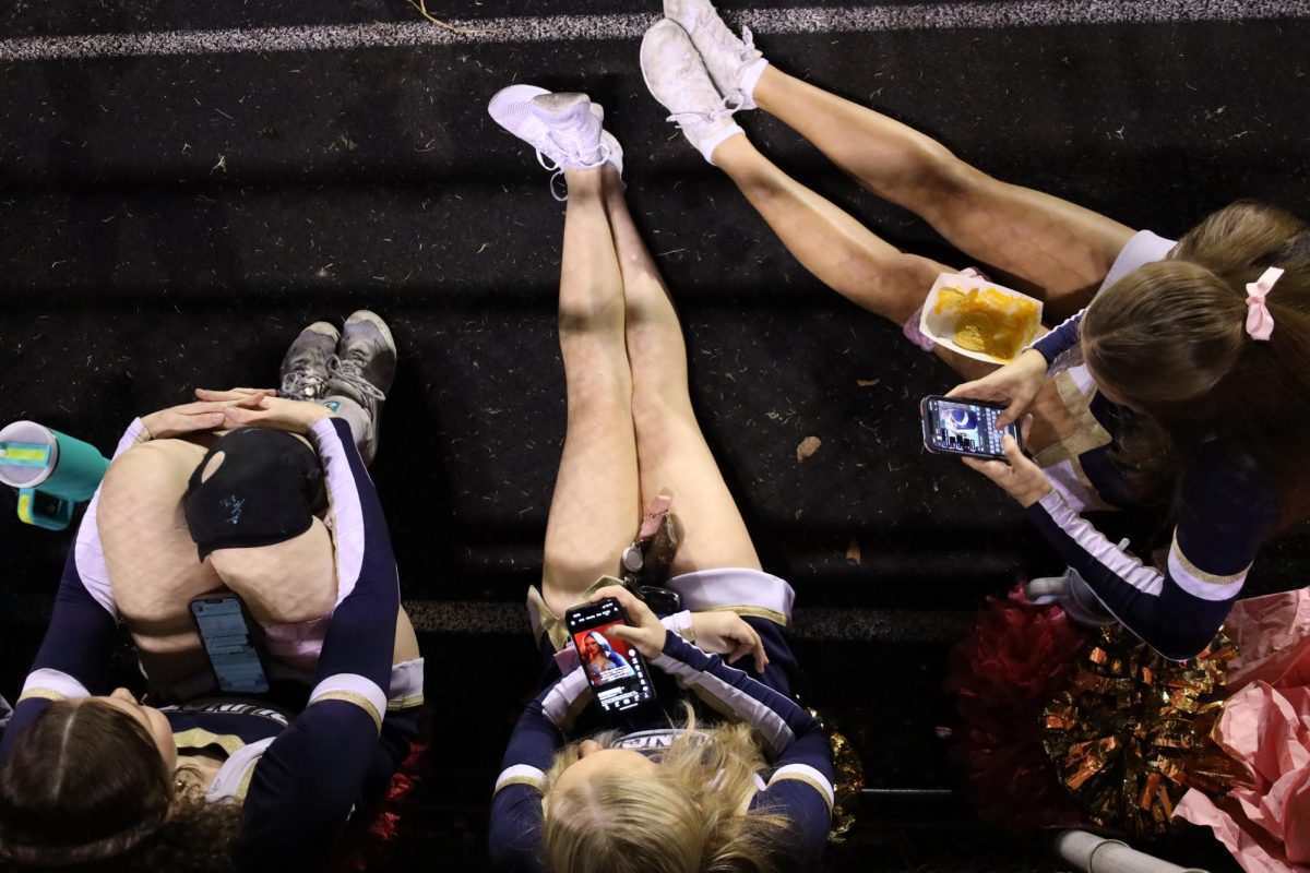 Arlington cheerleaders take a break during halftime.