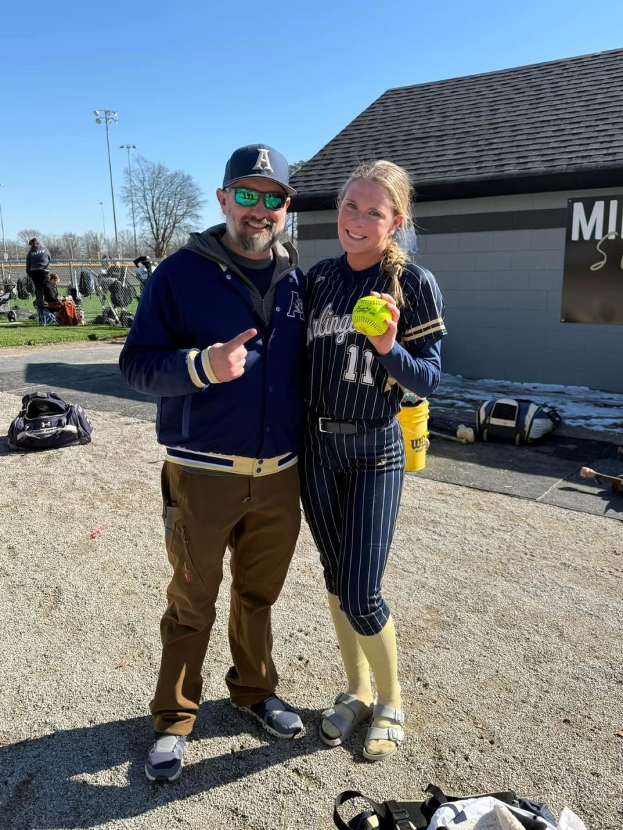 Senior 1st Baseman #11 Breleigh Bunker with Coach Morgan and her homerun hit ball after the game.