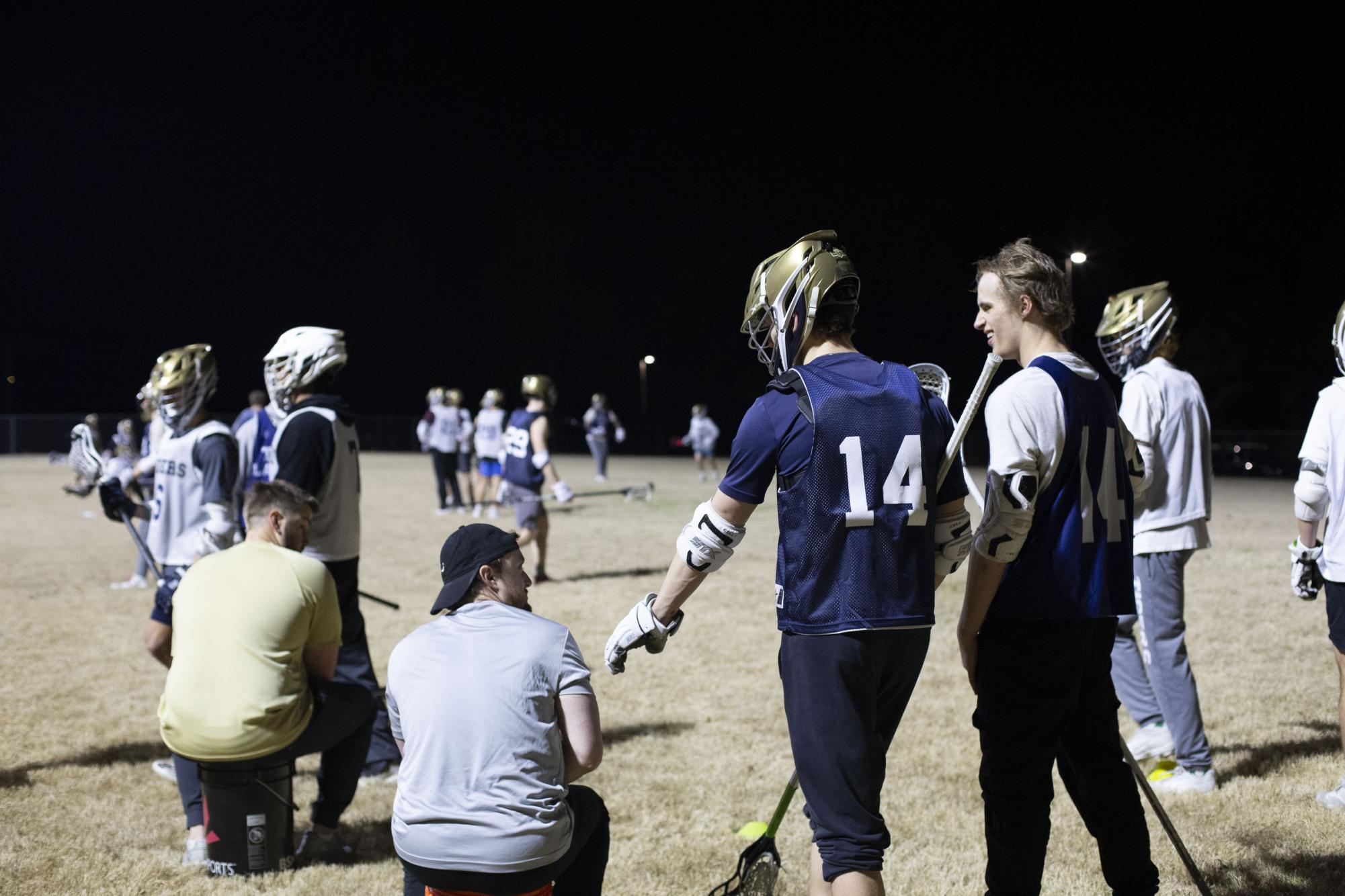 Liam Farrell #14 talking with Coach, Josh Kee
